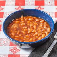 Baked Beans · Baked beans with bits of bacon, onion, garlic in a thick BBQ sauce.