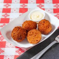 Hush Puppies to Go  · 4 pieces. Crunchy, gnarled, golden-brown beauties with chunks of onions.