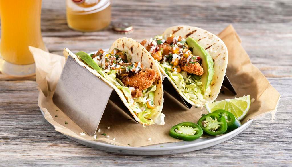 Street Tacos · Topped with freshly-made roasted tomato & corn salsa, shredded lettuce, avocado, fresh cilantro and queso fresco, served in lightly grilled tortillas.