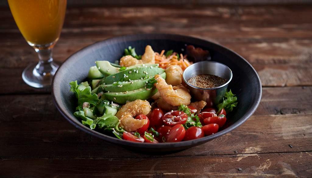 Cali Bowl · Your choice of protein with grape tomatoes, shredded carrots, cucumbers, drizzled with Sriracha-Lime Aioli & topped with fresh avocado, toasted sesame seeds & scallions. Served with a side of sesame soy sauce.