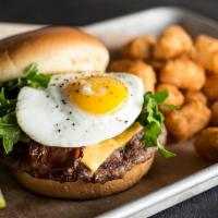 Brunch Burger · Fresh Angus beef patty topped with aged cheddar cheese, crisp applewood smoked bacon, arugul...