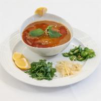 Delhi Nihari Curry · Beef shank gravy cooked perfectly to a smooth consistency and topped with finely sliced ging...