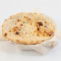 Naan · Perfectly knead fluffy dough carefully flattened and cooked in a fiery clay oven.