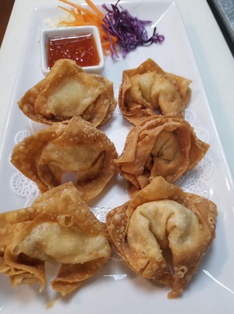 5. Crab Rangoon · Wonton stuffed with crab meat and cream cheese, deep-fried and served with sweet chili sauce.