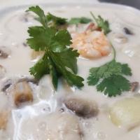11. Cup Tom Kha Soup · Hot and sour soup in coconut milk, mushrooms, lemongrass, galangal, kaffir-lime leaves and c...