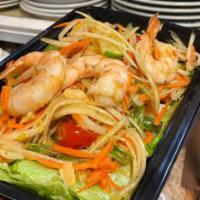 14. Green Papaya Salad · Shredded fresh green papaya, tomatoes, green beans, carrot, sliced fresh lime, tossed with f...