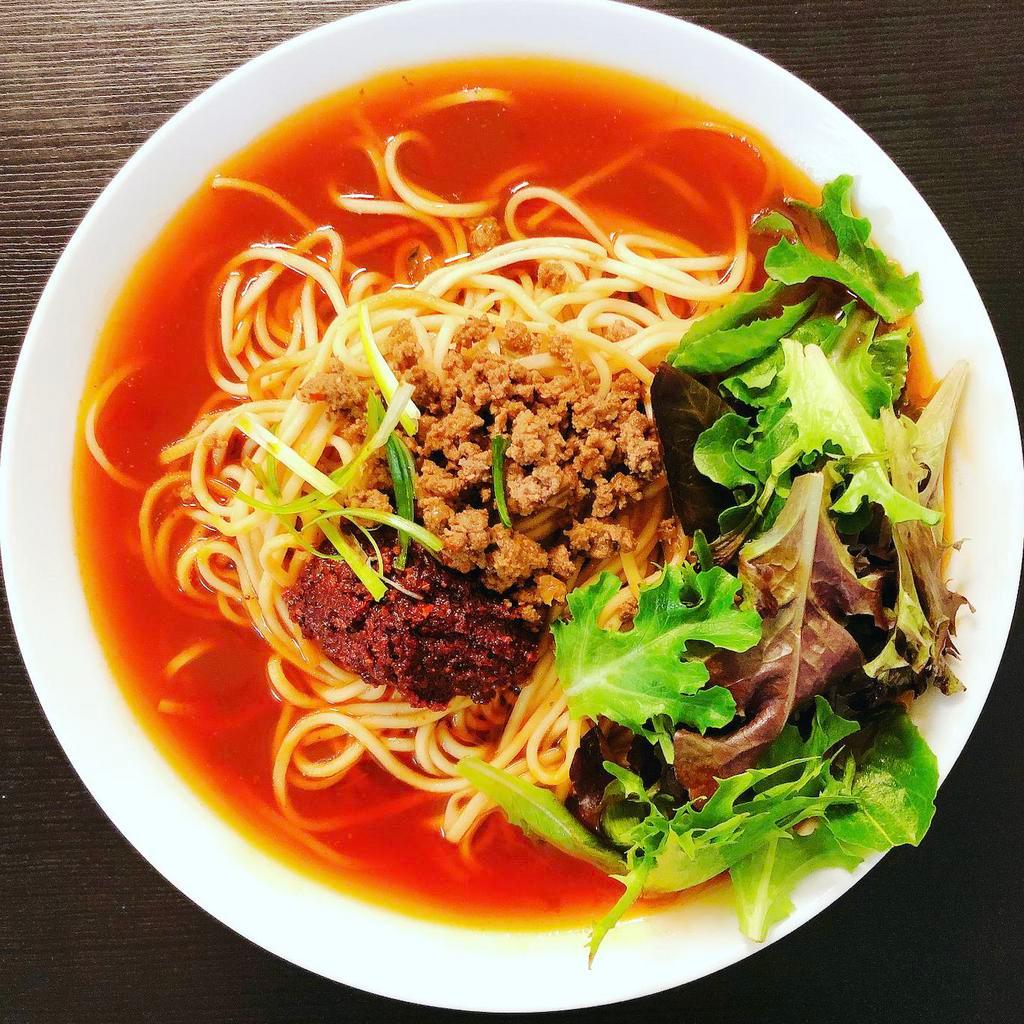 Chongqing Soup Ramen 重庆小面 · Authentic Spicy soup noodle. The soup based on soy sauce and premium Sichuan chili oil.
Topping with beef sauce, and green onion, fresh greens, bamboo shoots, corn, Chili paste.