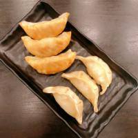 Steamed Pork Dumplings (6p) 蒸饺 · Serving of 6, served with a side of house-made dumpling sauce.