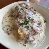 4. Creamed Chipped Beef on Toasted Baguettes · Thin pieces of salted and dried beef.