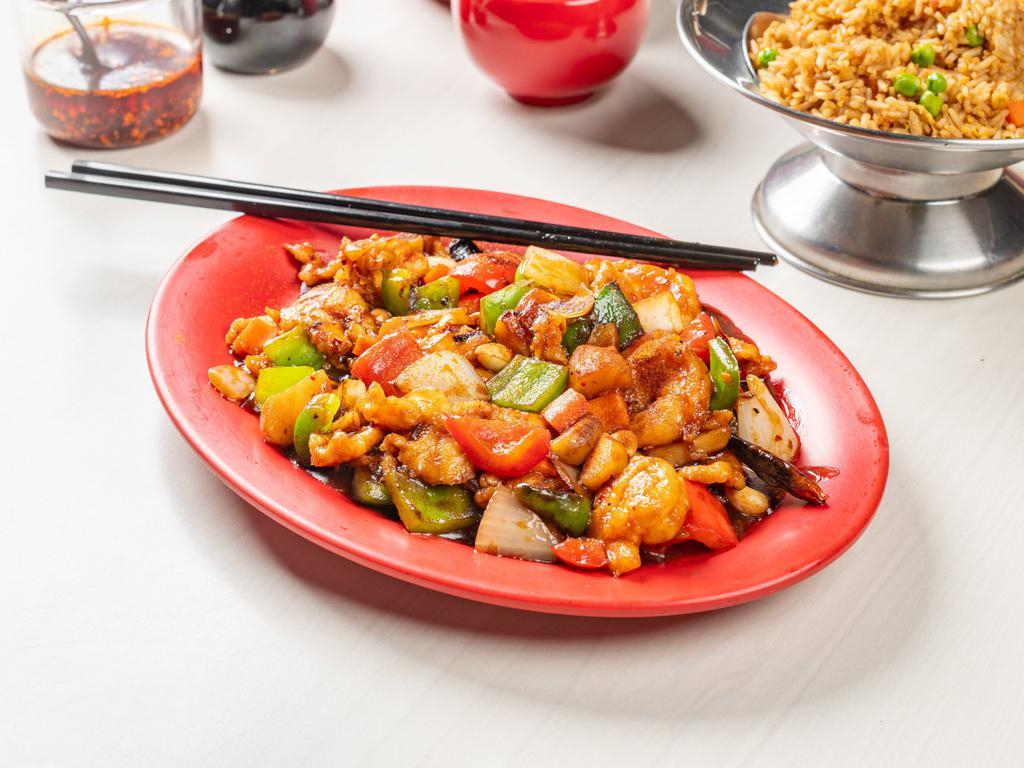 Kung Pao Special · Chicken, shrimp, beef and pork, cooked in a spicy brown sauce, flavored with red peppers and sprinkled with whole peanuts. Spicy.