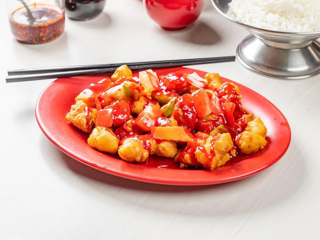 Sweet and Sour Pork · Chunks of deep-fried battered pork, coated with a sweet and sour sauce, with pineapple, onions, and green peppers.