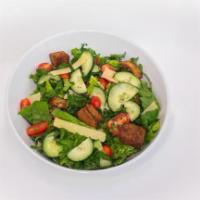 Kale Caesar Salad · Romaine, Kale, grape tomatoes, cucumber, parmesan cheese, Lilli's croutons, eggless Caesar d...