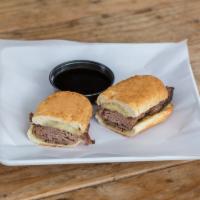 French Dip Sandwich · Roast beef and provolone on a garlic baguette with Au jus and horseradish.
