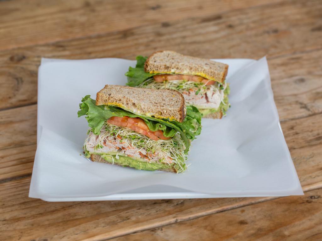 Kailua Club Sandwich · Turkey, avocado, Monterey jack cheese with lettuce, tomato, sprouts, mustard and mayo on multi grain.