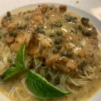 Veal Piccata · Comes with capers in lemon white wine sauce.