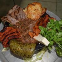 Molcajete Platillo · Carne asada, chorizo, pollo and carne enchilada. Grilled steak, chorizo, chicken and spicy m...