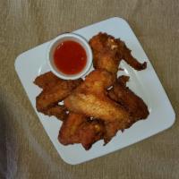 Wings · Deep-fried marinated chicken wings with sweet chili sauce.