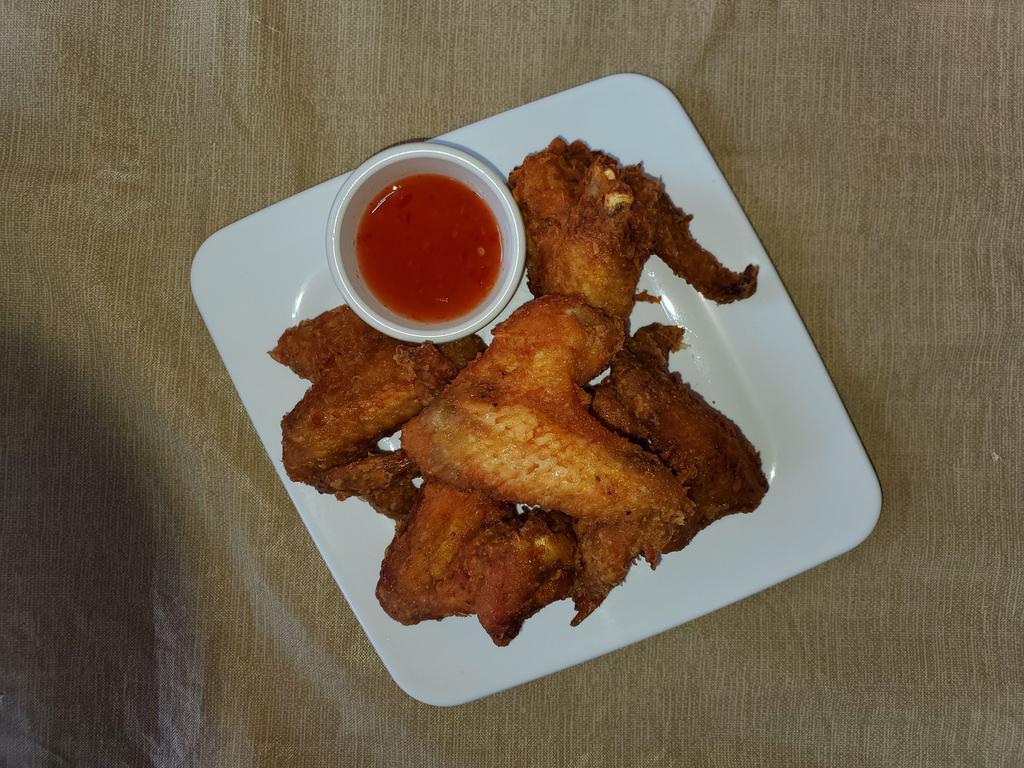 Wings · Deep-fried marinated chicken wings with sweet chili sauce.