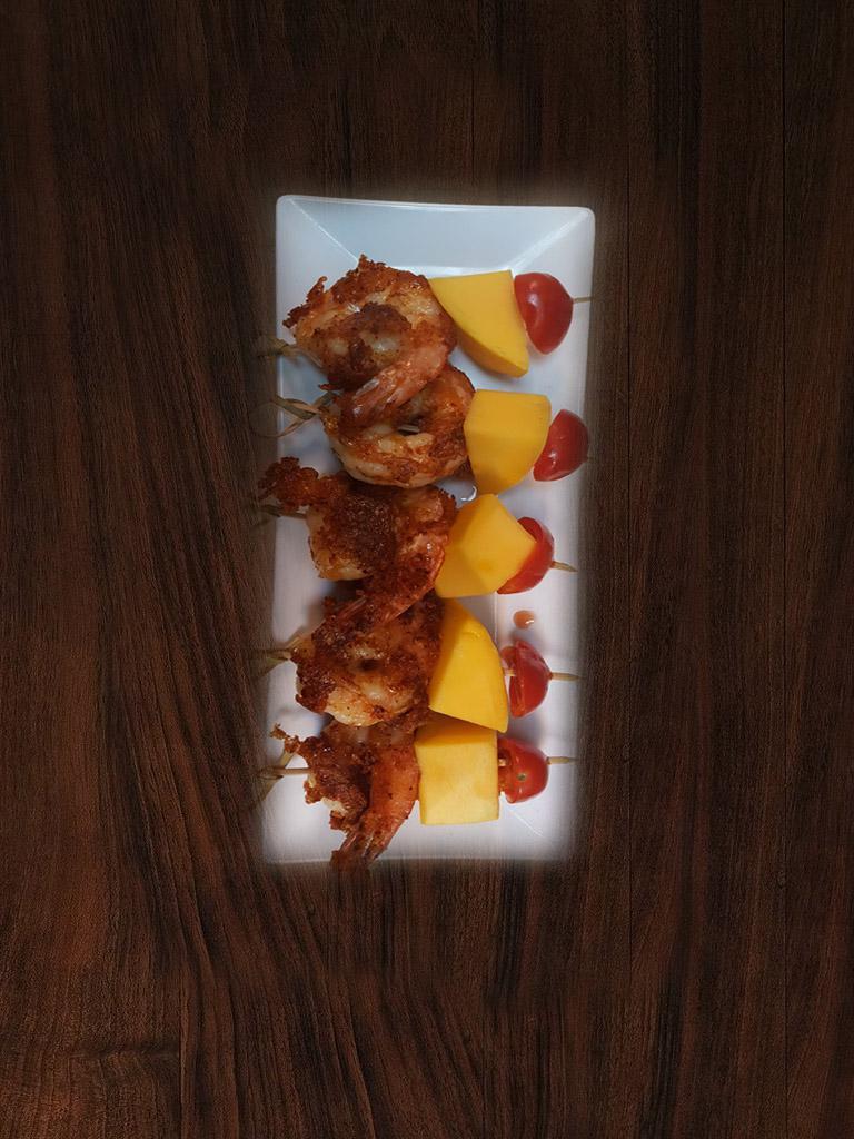 5 Pieces Spicy Shrimp Tapas · Shrimp spiced with herbal mix and mango, tomato on skewers.