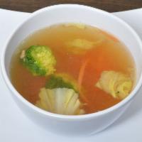 Lemongrass Tom Yum Soup · Served with chicken, onion, bell, mushroom, tomato, lemongrass, galanga and cilantro.