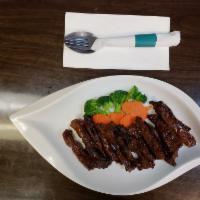 Country-Style Steak · Grilled and marinated flank steak with house special sauce. 