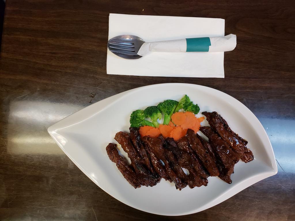 Country-Style Steak · Grilled and marinated flank steak with house special sauce. 