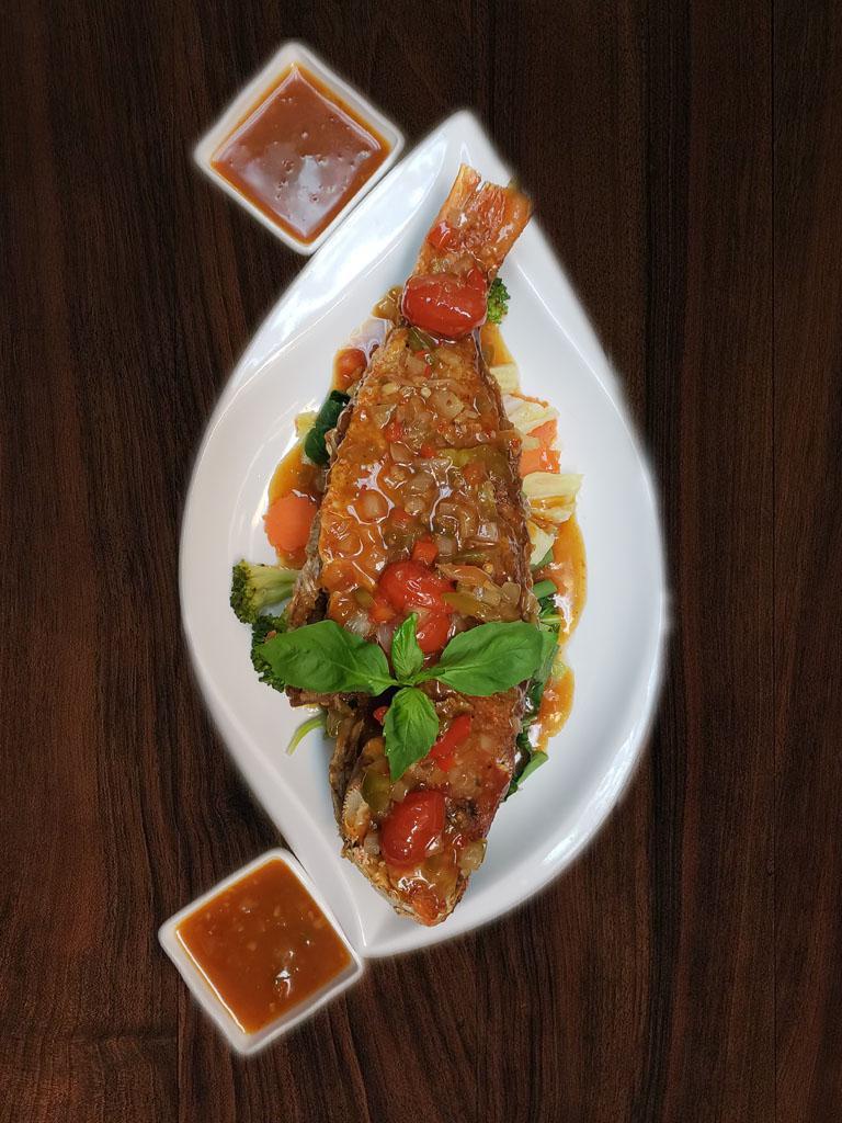 Pla Rad Prik · Fried whole red snapper with prik sauce and mix vegetable. 