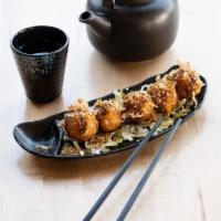 Takoyaki · 5 pieces of takoyaki ball inside squid and vegetable topped spicy mayo eel sauce and fish fl...