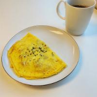 Breakfast Omelette · Three Eggs Omelette with Melted Cheese of Your Choice with Additional Protein or Toppings