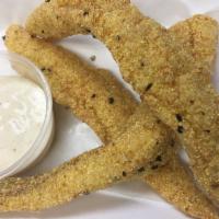 Catfish Strips (3) pc. · Cornmeal Dusted Golden Fried Mississippi Catfish Strips w/ Remoulade Tartar sauce.