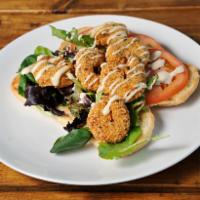 Shrimp Po'Boy · Gulf Shrimp Golden Fried w/ Fresh Spring mix & Sliced Tomatoes drizzled with Remoulade sauce...