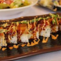 Black Dragon Roll 黑龙卷 · Spicy crab, avocado, cucumber inside, eel and avocado on top with eel sauce