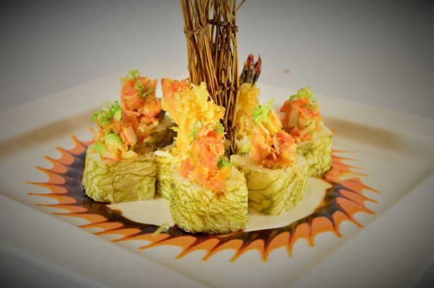 Volcano Roll · Shrimp tempura, cucumber inside, spicy tuna, shrimp, crab stick, avocado on top and spicy mayo eel sauce