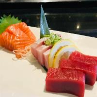 Sashimi 9 pcs · 3 pcs of salmon, 3 pcs of tuna, 3 pcs of hamachi. 