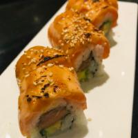 Miso Salmon Roll · Seared salmon, fresh salmon, avocado, house miso dressing, sesame, sushi rice, seaweed paper.