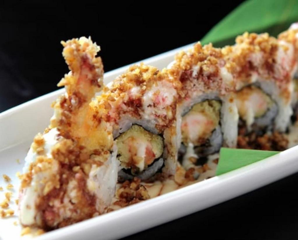 Tiger Roll · Shrimp tempura, real snow crab meat, sesame seeds, sushi rice, unagi sauce, paper.