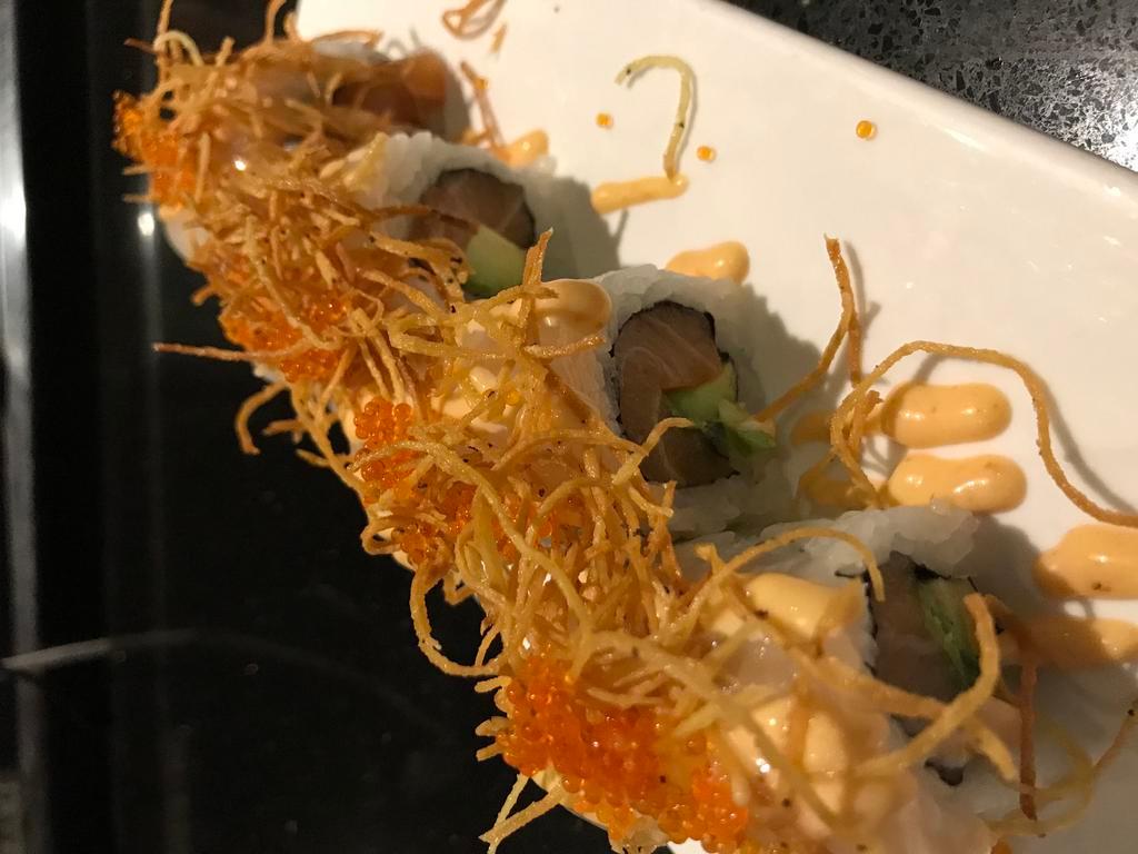 Romeo and Juliet Roll · Salmon, avocado, scallop, fried shredded potato, spicy cream sauce, sushi rice, seaweed paper.