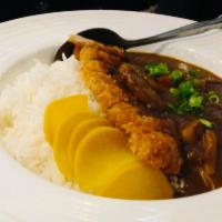 Curry Ton-Katsu · Japanese yellow curry sauce over deep-fried boneless pork loin cutlet, broccoli, mushroom, o...