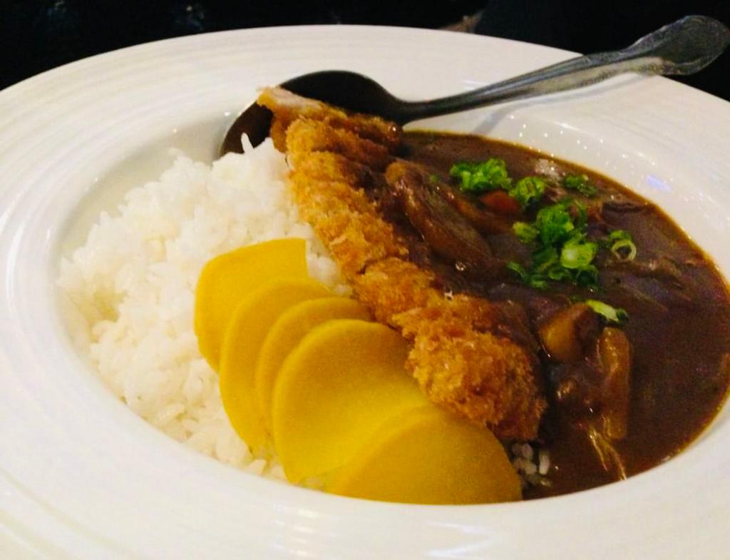 Curry Ton-Katsu · Japanese yellow curry sauce over deep-fried boneless pork loin cutlet, broccoli, mushroom, onion.