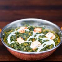 Saag Paneer · Cubes of homemade cheese smothered in ground spinach.