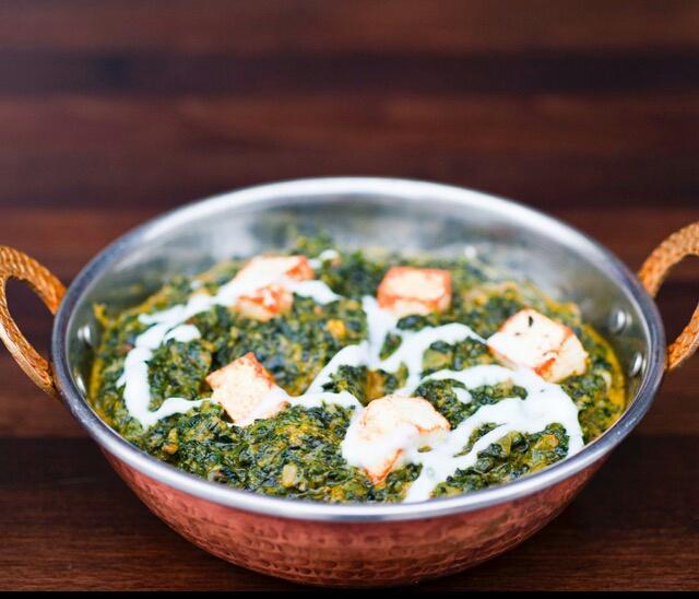Saag Paneer · Cubes of homemade cheese smothered in ground spinach.