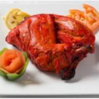 Tandoori Chicken · Chicken marinated in yogurt spices and broiled in our charcoal clay oven.