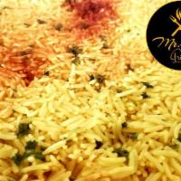 Rice · Basmati yellow rice, perfectly steamed and fluffy.