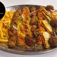 Combo Platter (serves 2-3) ·  1 skewer of: tawook, chicken kafta, lamb kafta, beef shawarma served with hummus, house sal...