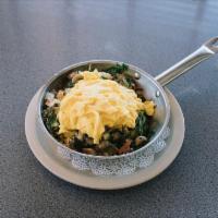 Veggie Skillet · Topped with two eggs. Assorted vegetables and cheddar cheese