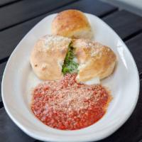 Spinach Calzone · Spinach, Mozzarella, Ricotta and Romano Cheese Stuffed In Our Homemade Crust. Baked And Serv...