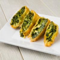 Spanakopita · Crispy phyllo stuffed with spinach and feta. Vegetarian.