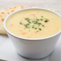 Lemon Chicken Soup · With roasted chicken, rice, herbs, and served with warm pita.
