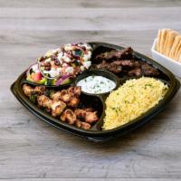 Mediterranean Family Feast · A choice of 2 proteins and 2 sides. Served with warm pita bread and a choice of sauce.