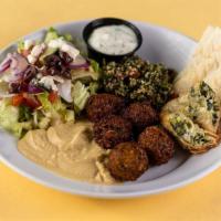 Vegetarian Plate · Tabbouleh, chickpea falafel, spanakopita, hummus, a Greek side salad, tzatziki and warm pita...